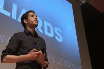 Aymen Benali on stage at TEDxHECMontréal